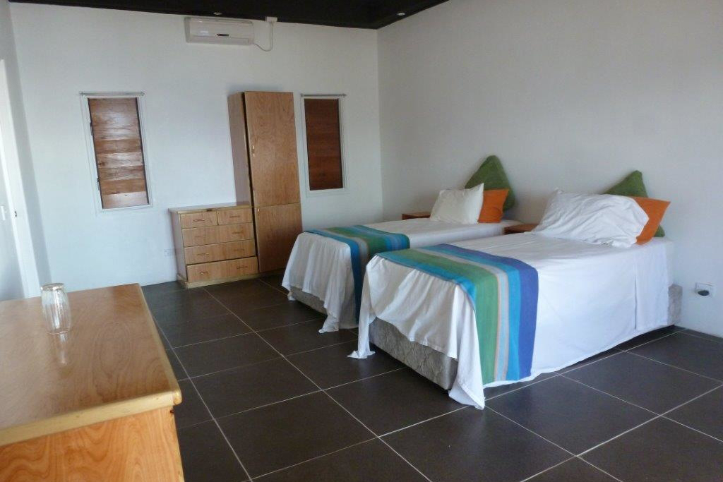 A bedroom of a Bayview Heights Villa at Daku Resort, Savusavu.