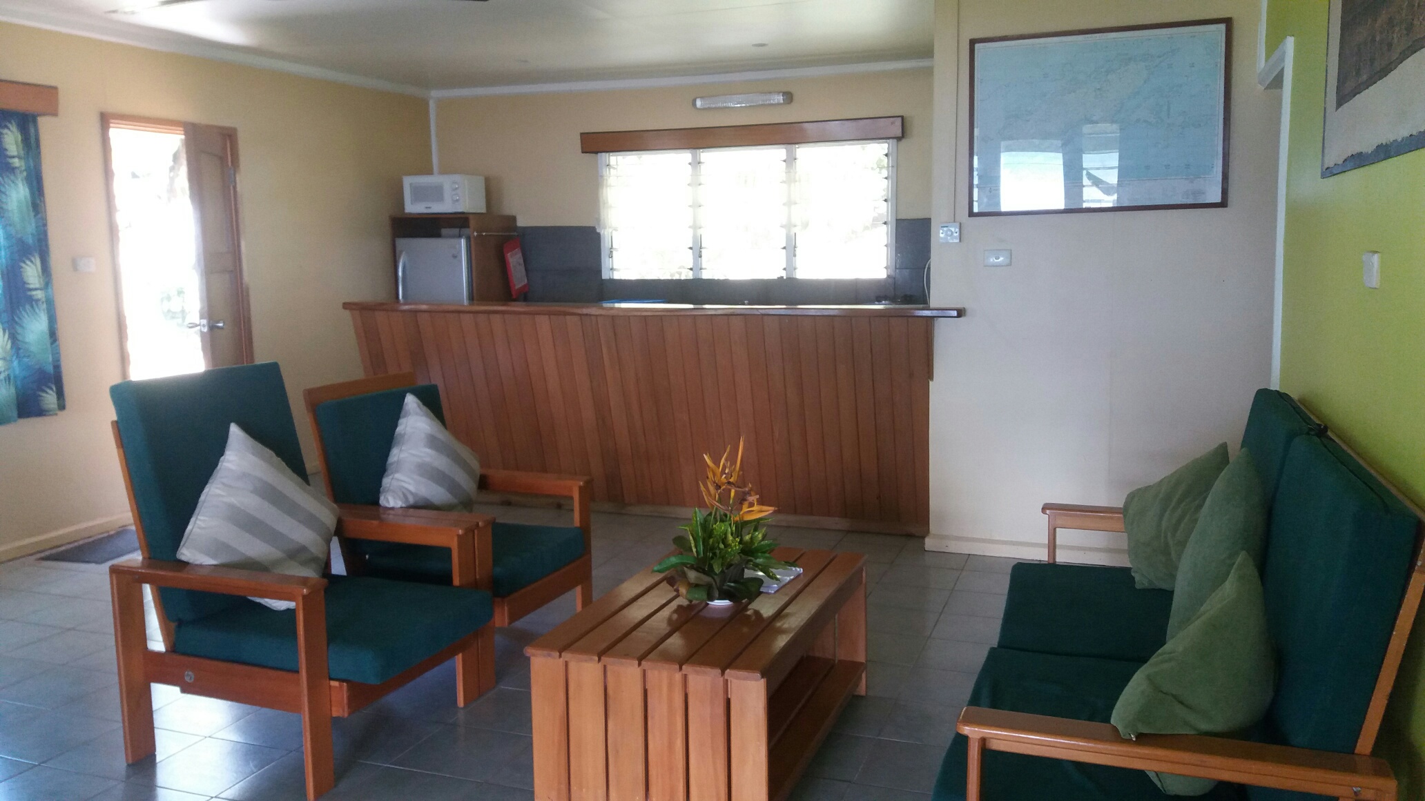 The lounge and kitchen of the Beach House at Daku Resort, Savusavu.